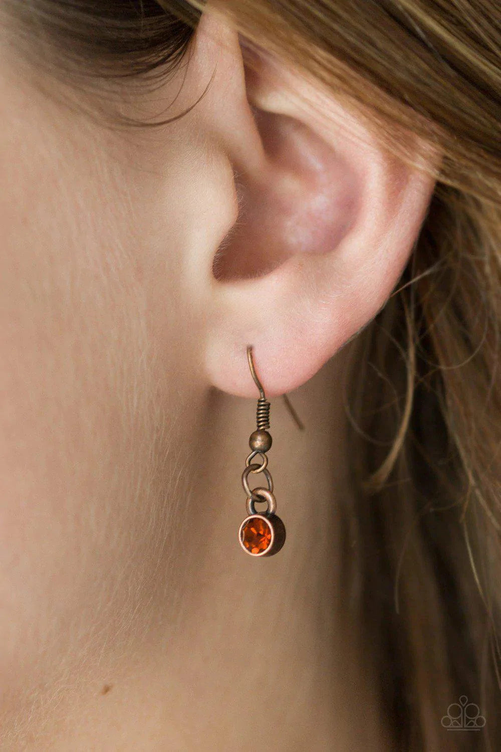Paparazzi Accessories Timeless Trio - Copper Encrusted in radiant rhinestones, three copper hoops interlock at the bottom of an elongated copper chain for an elegant look. Features an adjustable clasp closure. Sold as one individual necklace. Includes one