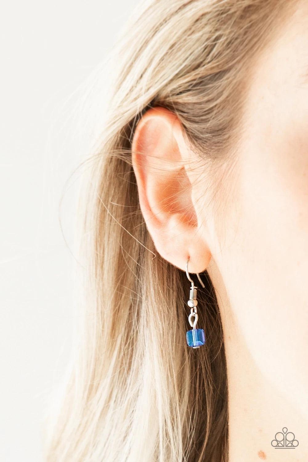 Paparazzi Accessories Block Party Princess - Blue A strand of iridescent blue crystal-like cube beading joins a classic strand of silver chain below the collar, creating refined layers. Features an adjustable clasp closure. Sold as one individual necklace