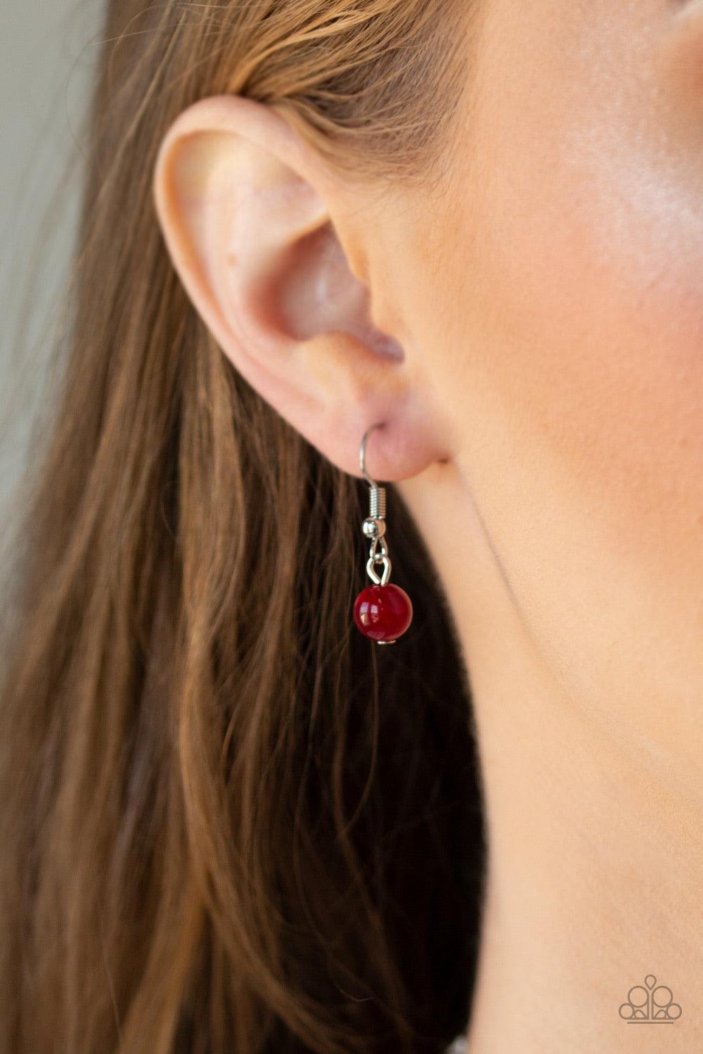 Paparazzi Accessories Colorfully Cosmopolitan - Red Infused with a plain silver chain, a collection of round and faceted red acrylic beads link below the collar for a whimsically colorful finish. Features an adjustable clasp closure. Jewelry