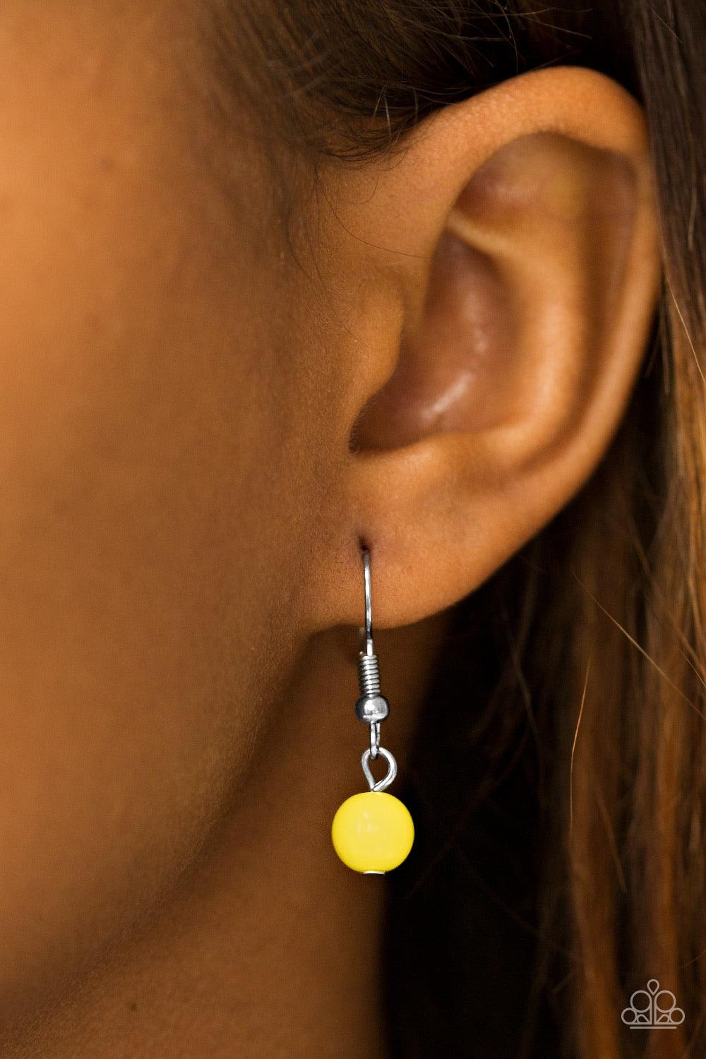 Paparazzi Accessories Boulevard Beauty - Yellow Featuring glassy and polished finishes, sunny yellow beads cascade from the bottom of textured silver links, creating a gorgeous clustered fringe below the collar. Features an adjustable clasp closure. Jewel