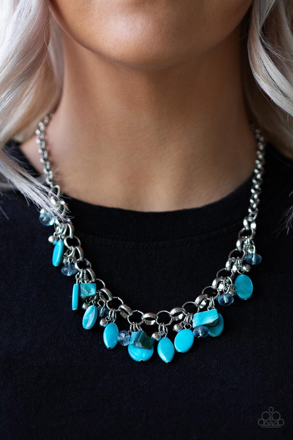 Paparazzi Accessories I Want to SEA the Word - Blue A collection of blue shell-like beads, blue crystal-like beads, and shiny silver beads swing from a bold silver chain, creating a whimsical fringe below the collar. Features an adjustable clasp closure.