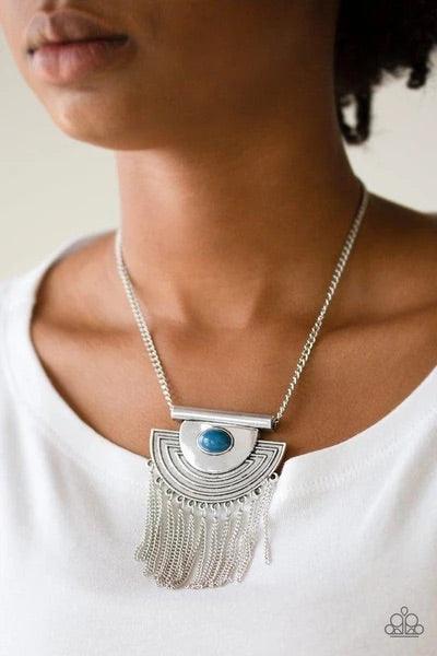 Paparazzi Accessories When in Roam - Blue A refreshing blue bead is pressed into the center of an antiqued silver crescent shaped pendant radiating with geometric patterns. Antiqued silver tassels swing from the bottom of a bold pendant, creating a fierce