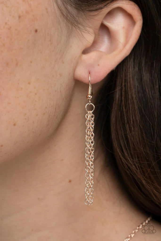 Paparazzi Accessories Marrakesh Mystery - Rose Gold Featuring mandala-like patterns, a floral lattice frame gives way to mismatched scalloped rose gold frames, creating a magnificently stacked pendant at the bottom of an extended rose gold chain. Features