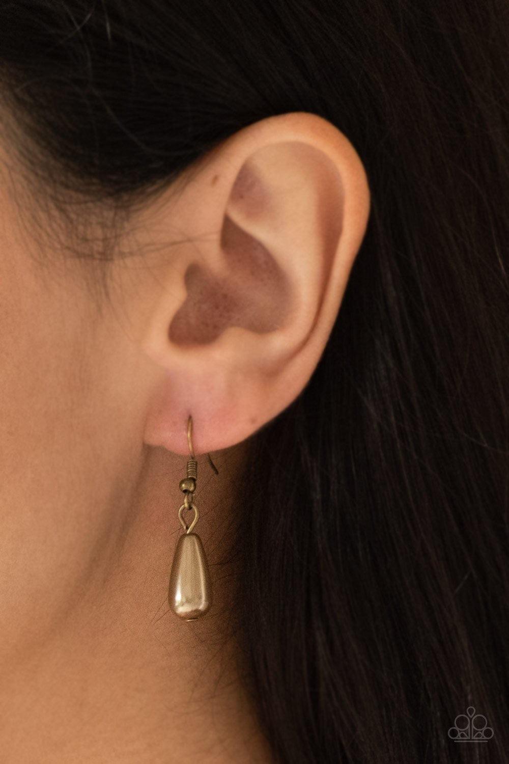 Paparazzi Accessories Rustic Ritz - Brass Pearly brass teardrop beads swing from the tops of delicately hammered brass teardrop frames, creating a refined fringe below the collar. Features an adjustable clasp closure. Jewelry