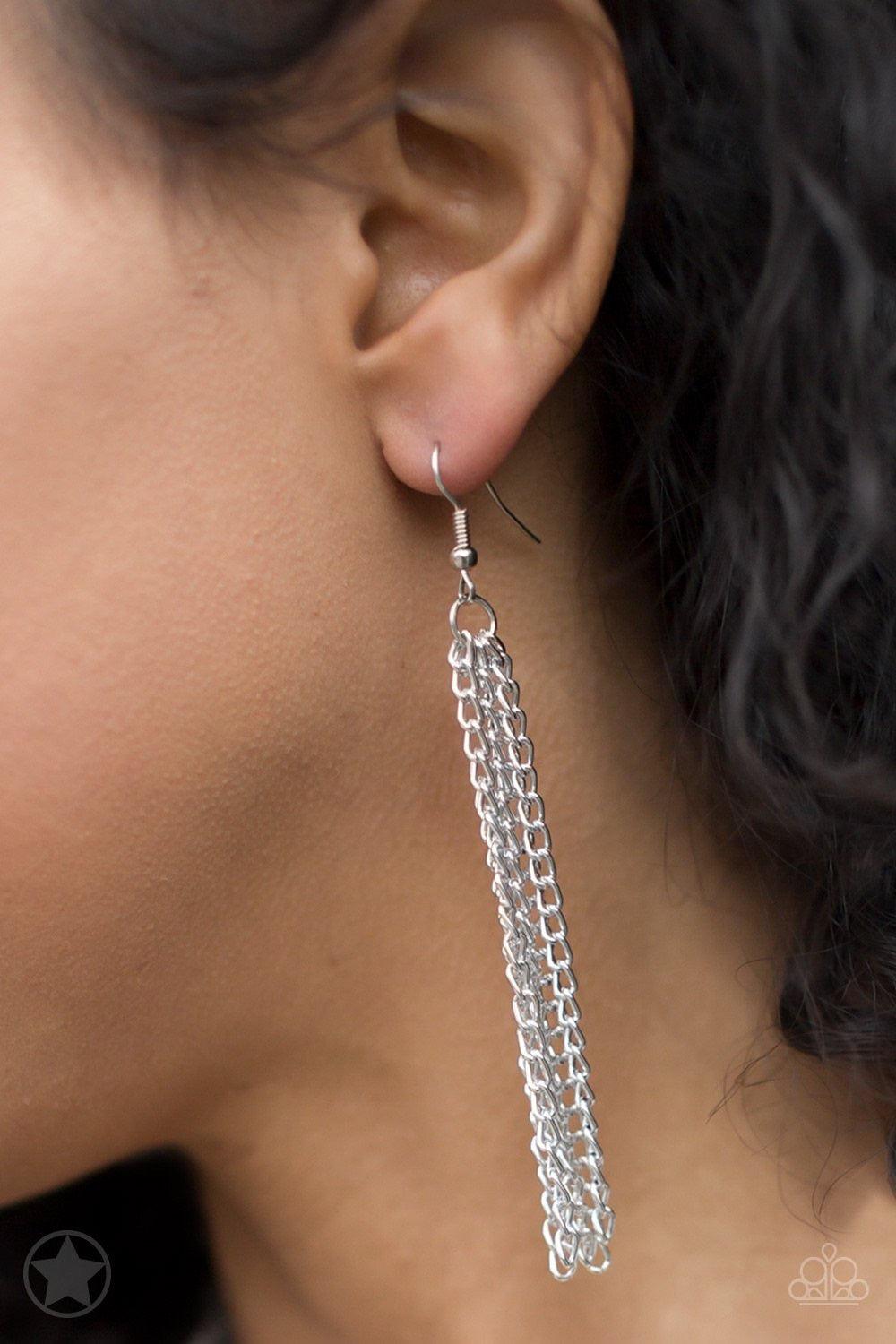 Paparazzi Accessories SCARFed for Attention - Silver A single strand of spiraling, interlocking links with light-catching texture is anchored by two tassels of chain that add dramatic length to the piece. Undeniably the most versatile piece in Paparazzi's