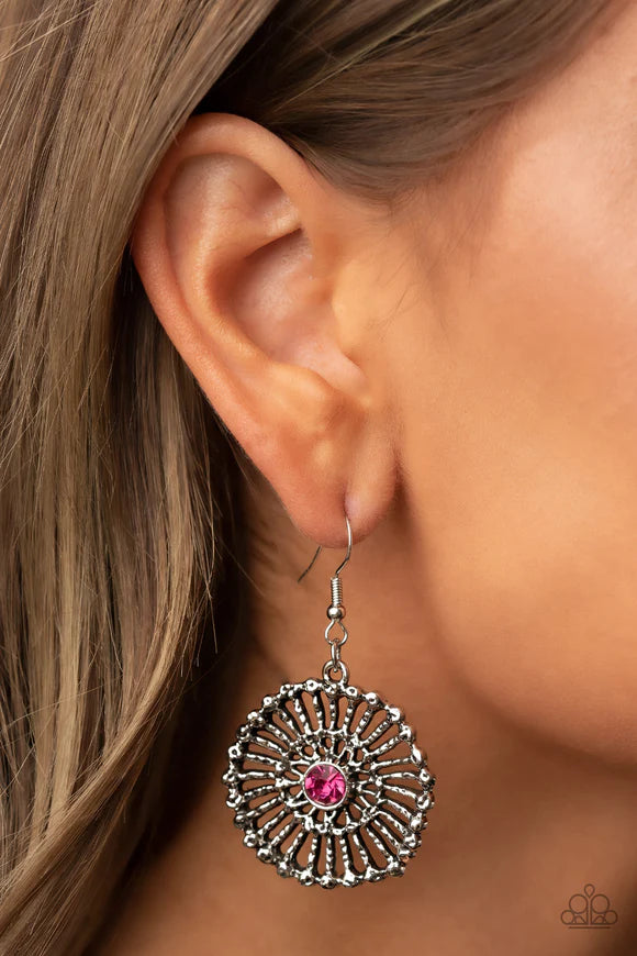 Paparazzi Accessories Tangible Twinkle - Pink Hammered silver spokes flare out from a glittery pink rhinestone center, resulting in a studded silver frame. Earring attaches to a standard fishhook fitting. Sold as one pair of earrings. Earrings