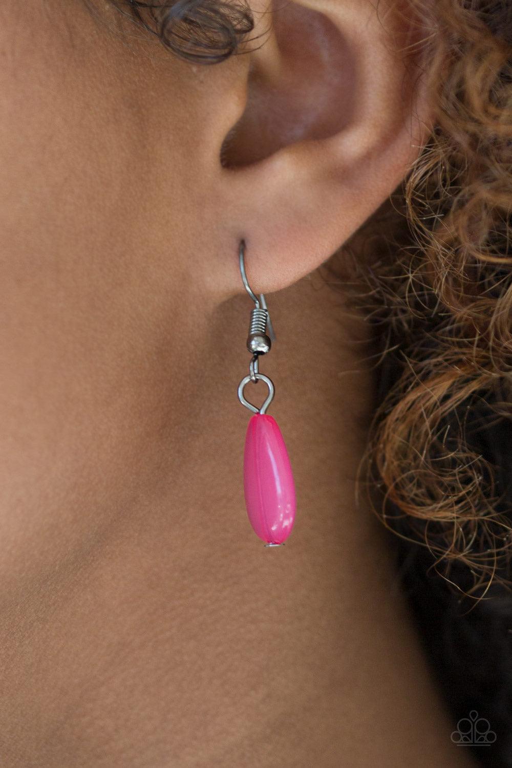 Paparazzi Accessories Diva Attitude - Pink Glistening gunmetal and vivacious pink teardrops drip from the bottom of interlocking gunmetal chains. Matching gunmetal and pink beads trickle down the rows of chain, creating a bold fringe below the collar. Fea