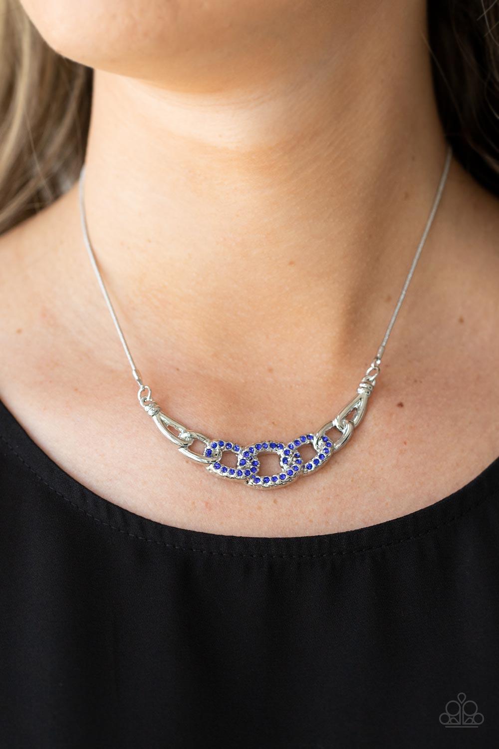 Paparazzi Accessories KNOT In Love - Blue Shiny silver links, encrusted with dainty blue rhinestones, connect into a glamorous centerpiece below the collar. Features an adjustable clasp closure. Sold as one individual necklace. Includes one pair of matchi