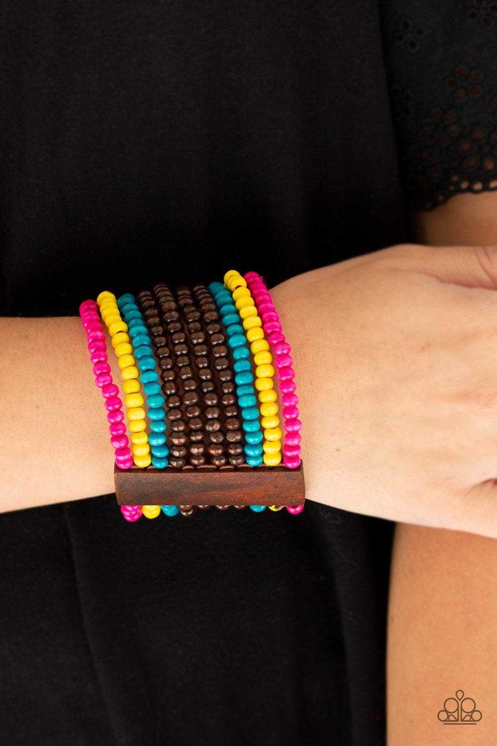 Paparazzi Accessories Jamaican Me Jam - Multi Infused with rectangular wooden beads, a collection of blue, brown, pink, and yellow wooden beads are threaded along stretchy bands for a summery flair. Jewelry