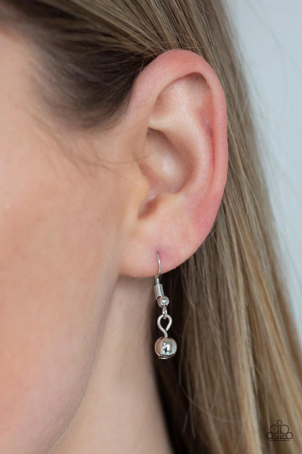 Paparazzi Accessories Ring Leader Radiance - Silver Rows of shiny silver beads and hammered rings swing from the bottom of interlocking silver chains, creating a bold fringe below the collar. Features an adjustable clasp closure. Sold as one individual ne