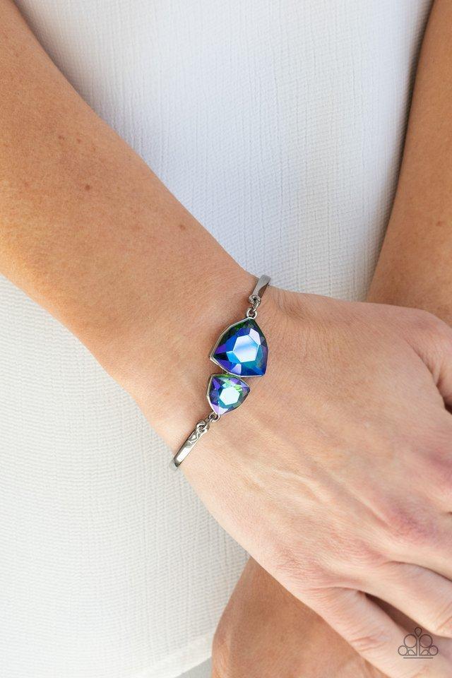 Paparazzi Accessories Deep Space Shimmer - Multi Featuring raw gem cuts, a pair of iridescent rhinestones connect to dainty gunmetal bars around the wrist, creating a stellar cuff-like bracelet. Features an adjustable clasp closure. Large colorful jewels