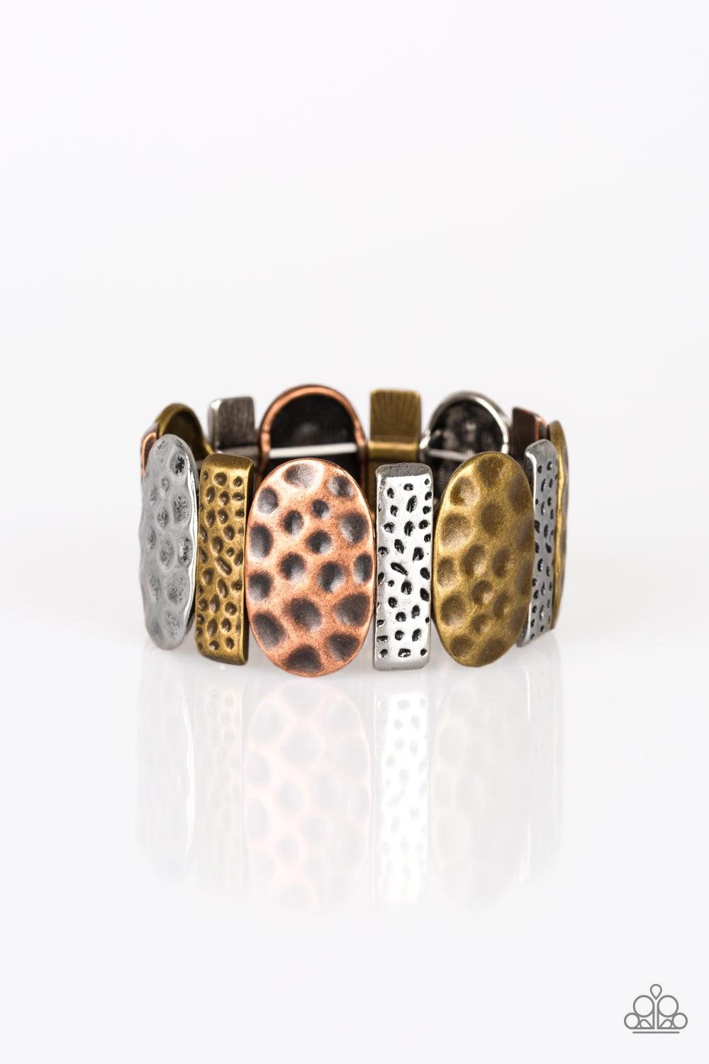 Paparazzi Accessories Cave Cache - Multi Delicately hammered in antiqued detail, round and rectangular shaped frames are threaded along stretchy bands, creating a bold tribal look around the wrist. Jewelry