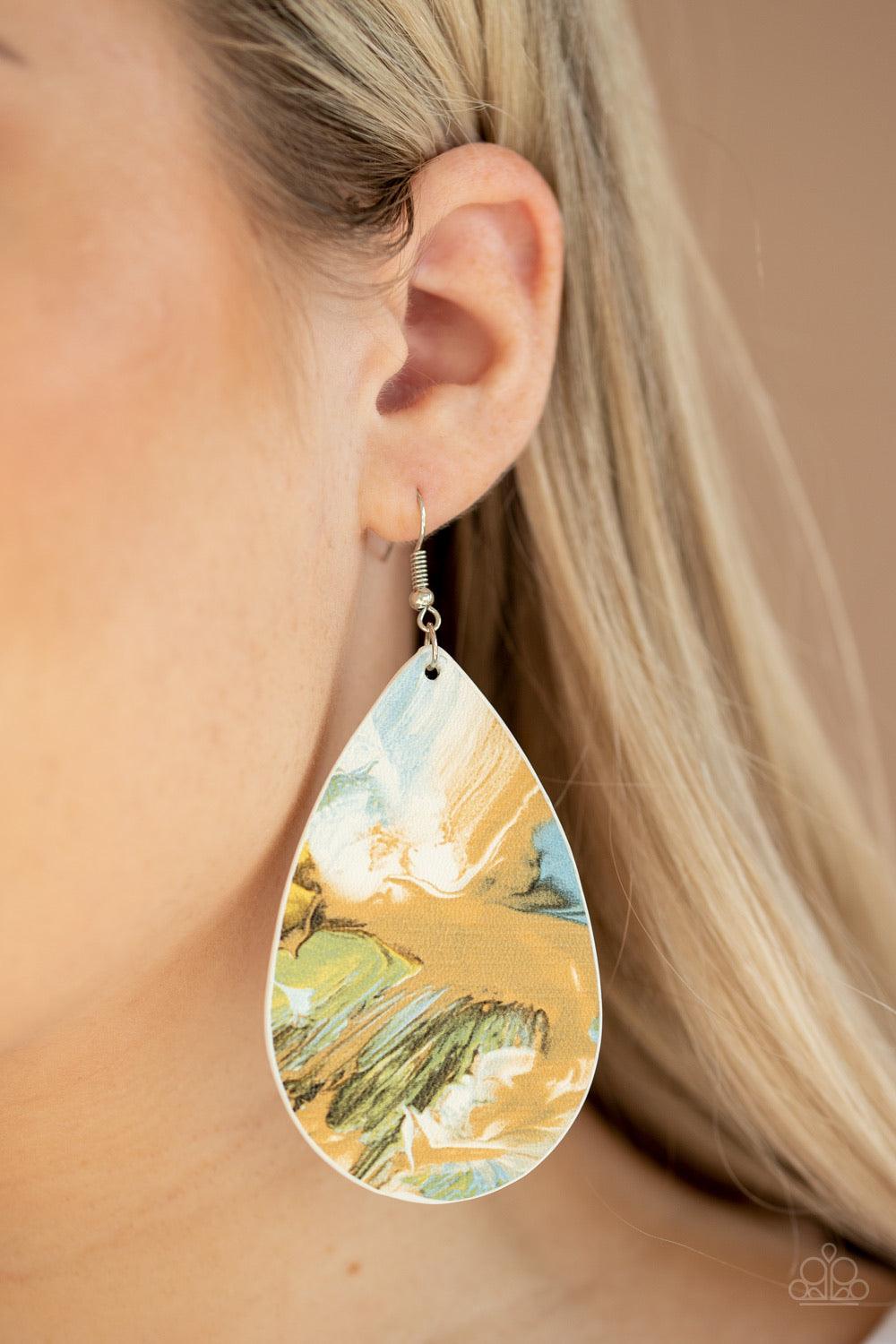 Paparazzi Accessories Mesmerizing Mosaic - Multi Featuring a mosaic of blue, brown, green, and white swirls, a pair of mismatched leathery teardrops swing from the ears for a seasonal flair. Earring attaches to a standard fishhook fitting. Jewelry