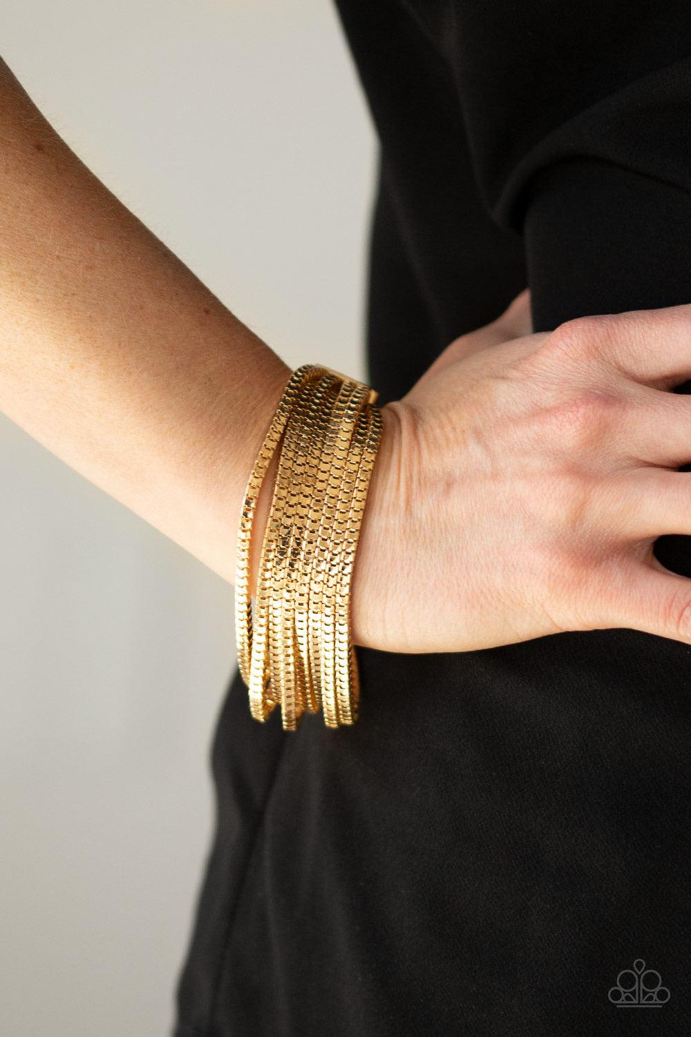 Paparazzi Accessories Out of The Box - Gold Row after row of glistening gold box chains are strung between two bold gold fittings, creating dramatic industrial inspired layers across the wrist. Features an adjustable clasp closure. Jewelry