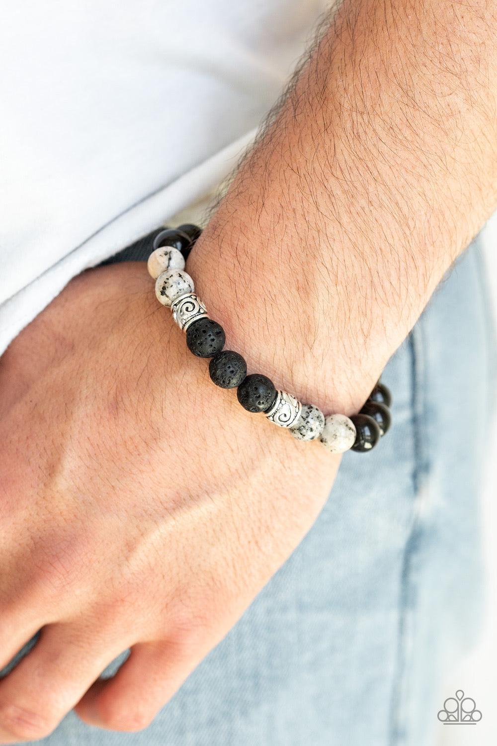 Paparazzi Accessories Mantra - White Infused with ornate silver beads, a collection of polished black beads, black lava rock beads, and speckled white stone beads are threaded along a stretchy band around the wrist for a seasonal look. Jewelry Sets