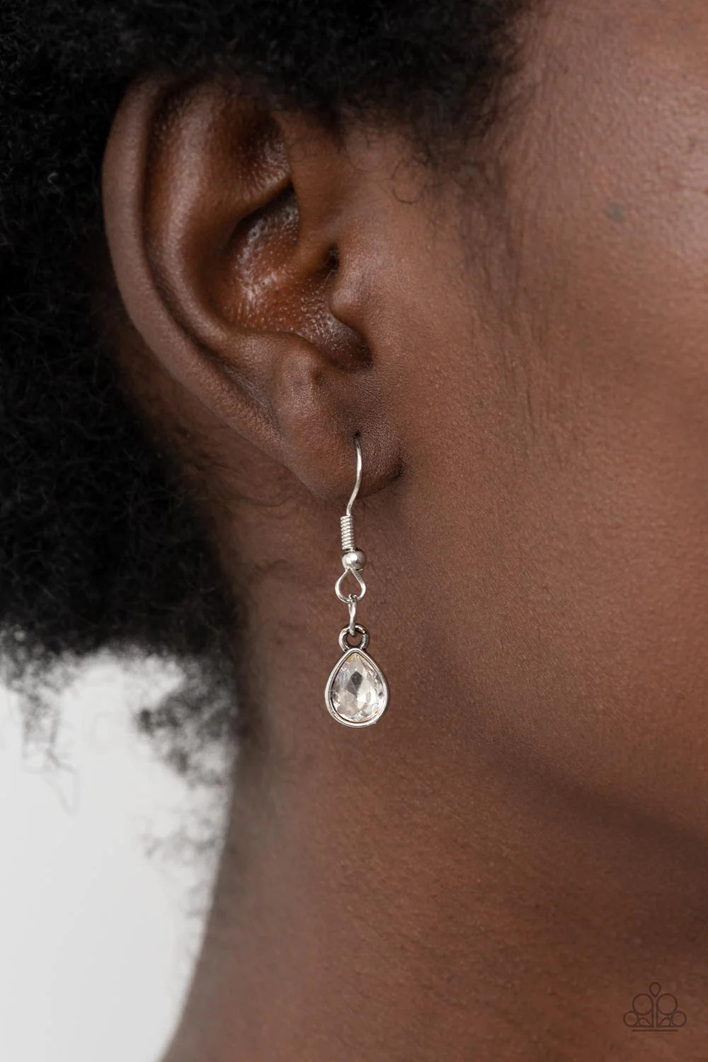 Paparazzi Accessories BLOOM Shaka-laka - Purple Encased in pronged silver fittings, a mismatched collection of oversized teardrop, round, and emerald cut rhinestones asymmetrically blooms from a bubbly purple pearl drop center for a surprisingly sparkly f
