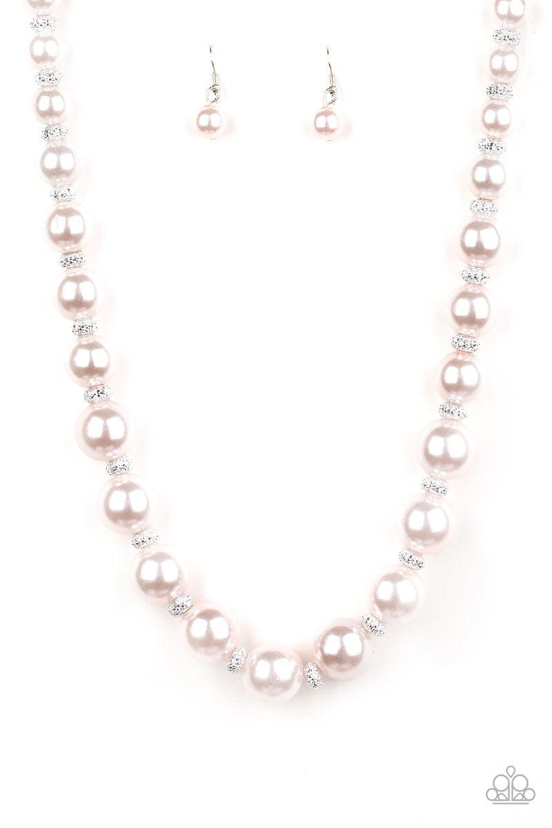 Paparazzi Accessories Uptown Heiress ~Pink Infused with dainty silvery rhinestone encrusted beads, a refined collection of over sized pink pearls are threaded along an invisible wire below the collar for timeless dazzle. Features an adjustable clasp closu