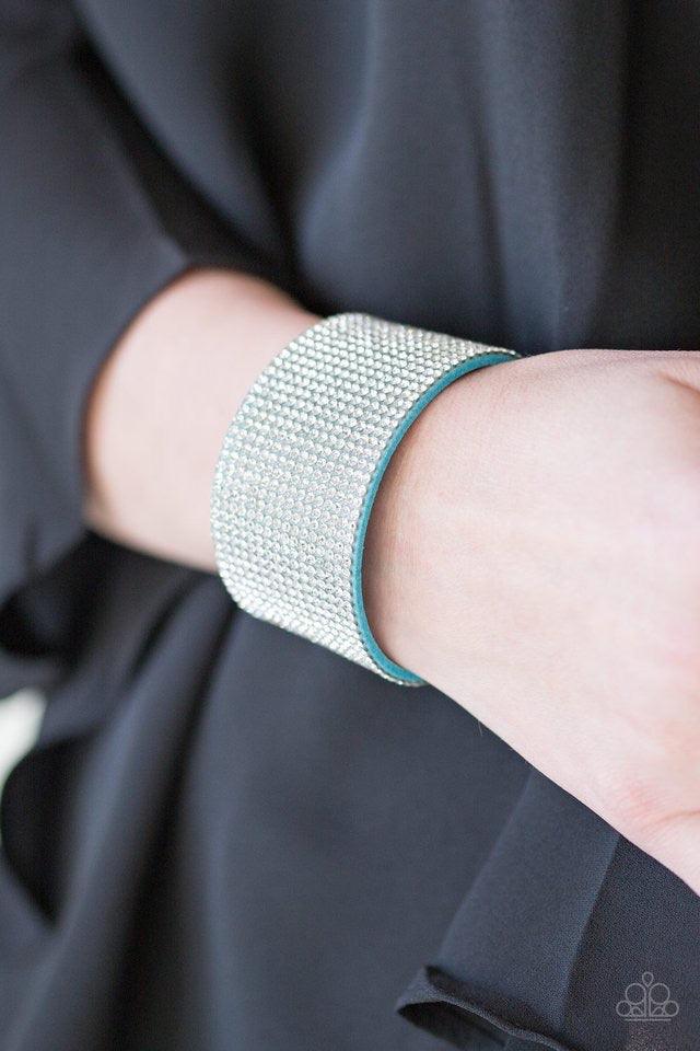 Paparazzi Accessories Roll With The Punches - Blue Row after row of glassy white rhinestones are encrusted along a thick blue suede band, creating knockout shimmer across the wrist. Features an adjustable snap closure. Bracelets