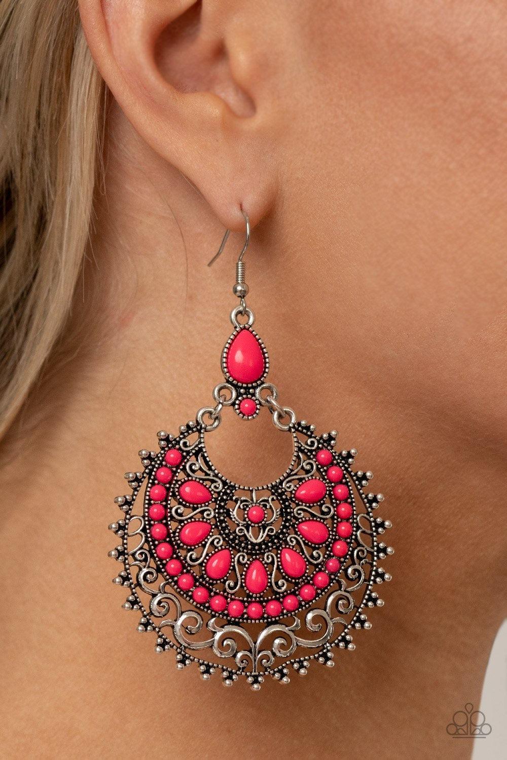 Paparazzi Accessories Laguna Leisure - Pink Featuring the flamboyant shade of Pink Peacock, a dainty collection of round and teardrop pink beads embellish the front of a decoratively studded and filigree filled silver frame for a whimsical splash of color