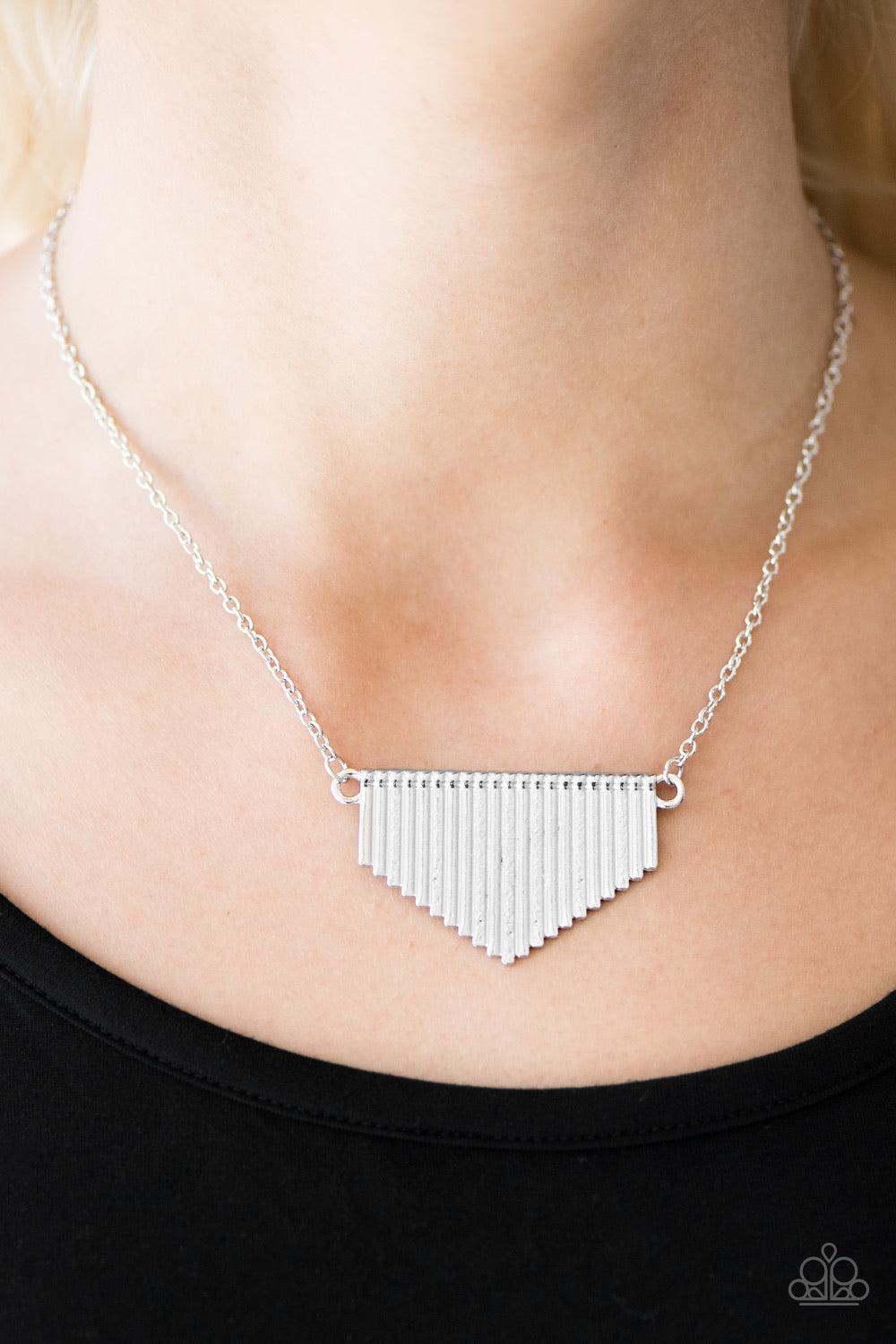 Paparazzi Accessories Imperially Industrial - Silver Delicately hammered in shimmery texture, glistening silver rods coalesce into a tapered pendant below the collar in a bold industrial fashion. Features an adjustable clasp closure. Sold as one individua