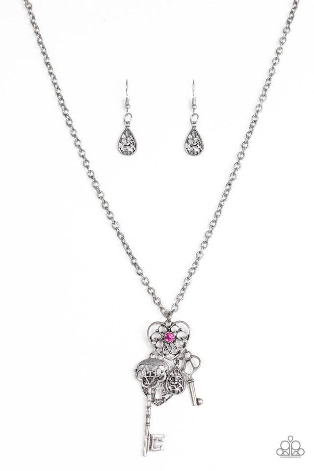 Paparazzi Accessories Secret of the Hearts - Pink Brushed in an antiqued silver shimmer, an ornate teardrop, heart-shaped lock, and two keys swing from the bottom of a vintage inspired heart pendant, creating a whimsical tassel. A dainty pink rhinestone i