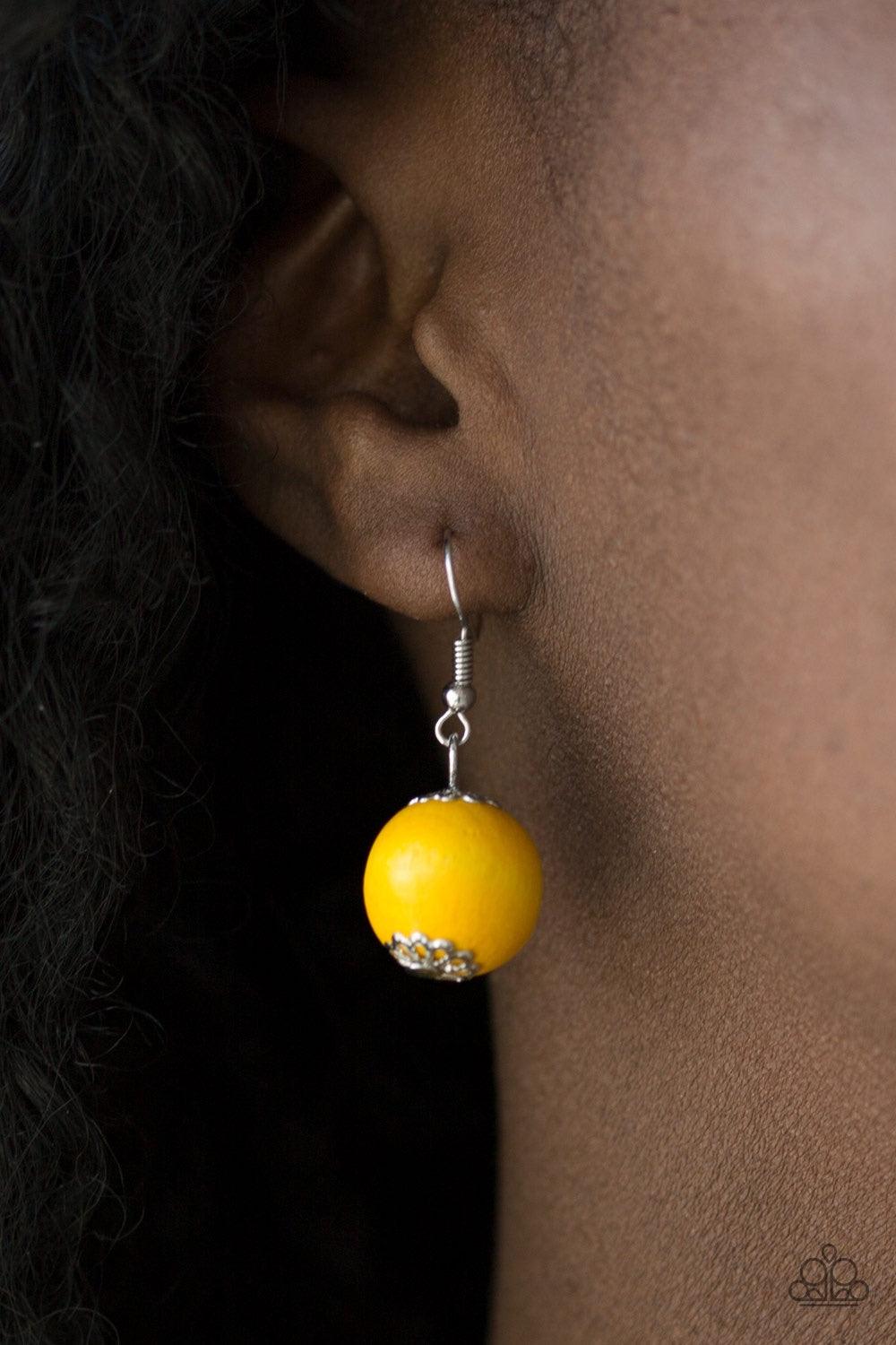 Paparazzi Accessories Caribbean Cover Girl - Yellow Brushed in a distressed finish, sunny yellow wooden beads and discs join below the collar for a summery look. Features a button loop closure. Jewelry