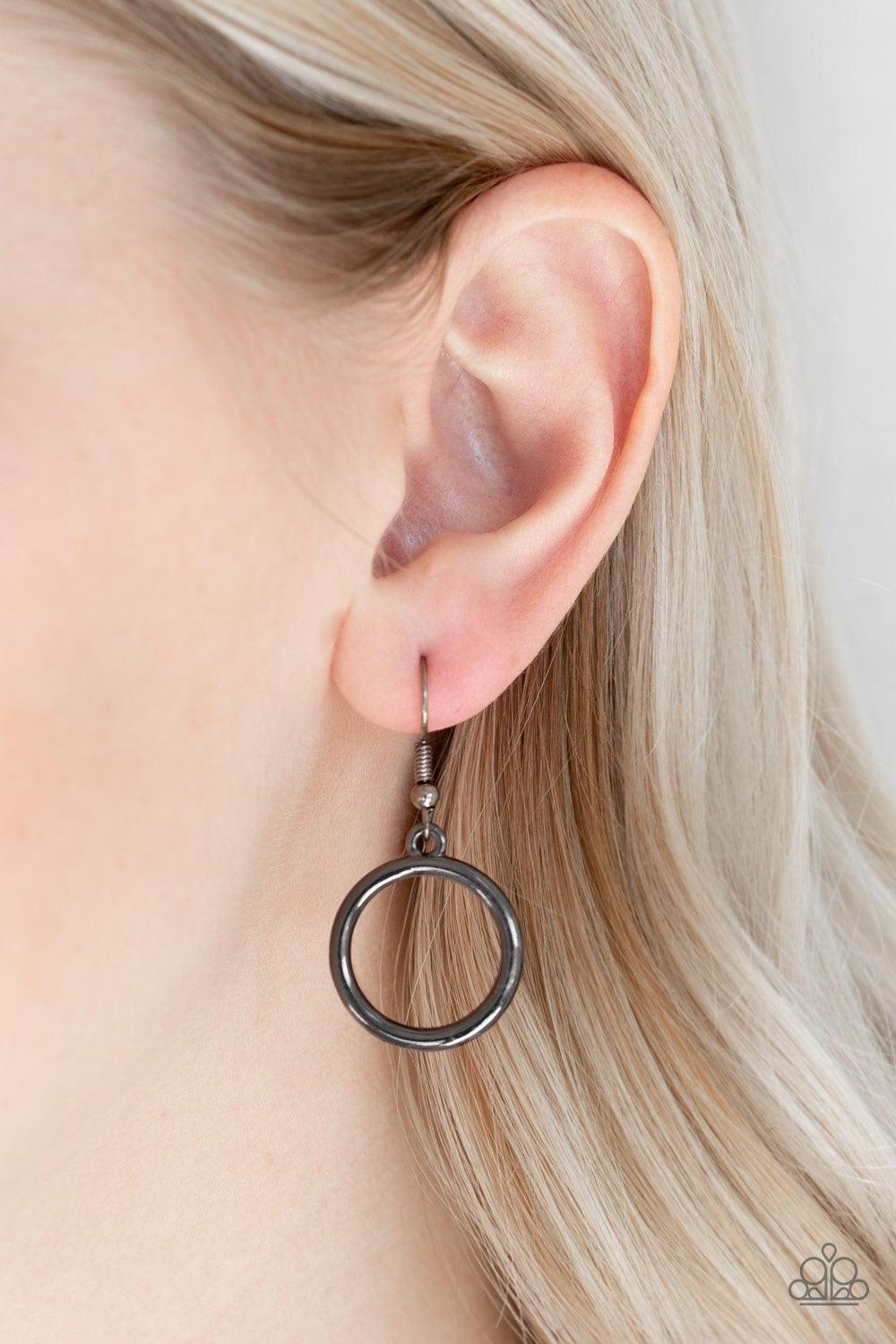 Paparazzi Accessories Walk Like An Egyptian - Black Two glistening gunmetal crescents attach to a large gunmetal hoop, creating a tribal inspired pendant below the collar. Features an adjustable clasp closure. Jewelry