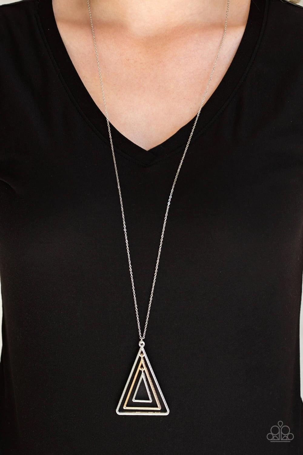 Paparazzi Accessories TRI Harder - Silver Infused with an elongated silver chain, glistening gold and silver triangular frames layer into a gorgeously stacked pendant for an edgy look. Features an adjustable clasp closure. Sold as one individual necklace.