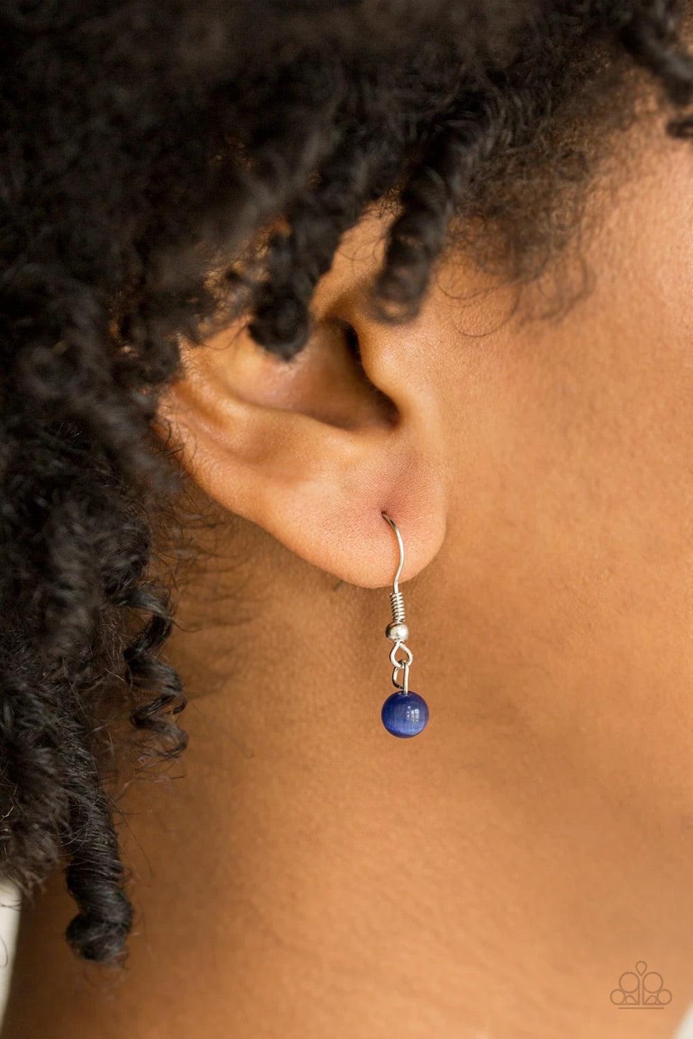 Paparazzi Accessories Just Drop It! - Blue Chiseled into a tranquil teardrop, a glowing blue moonstone is pressed into an abstract silver frame, creating a whimsical pendant. Features an adjustable clasp closure. Sold as one individual necklace. Includes