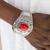 Paparazzi Accessories Majave Majesty - Red Delicately hammered and studded in tribal inspired textures, a thick silver cuff wraps around the wrist in an artisan inspired fashion. A smooth red stone is pressed into the middle of a silver sunburst pattern,