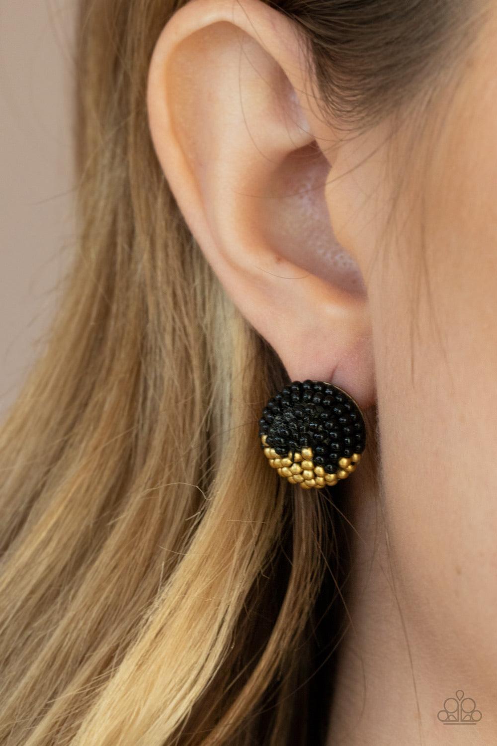 Paparazzi Accessories As Happy As Can BEAD - Black A dainty collection of black and brassy seed beads embellished the front of a circular frame, creating a colorful half and half pattern. Earring attaches to a standard post fitting. Sold as one pair of po