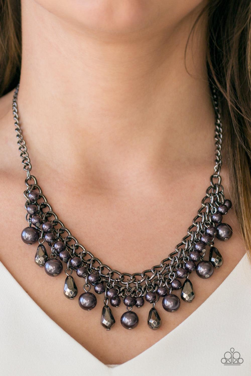 Paparazzi Accessories Imperial Idol - Black Varying in size, pearly gunmetal beads and faceted gunmetal teardrops drip from the bottoms of interlocking gunmetal chains, creating a bold industrial fringe below the collar. Features an adjustable clasp closu
