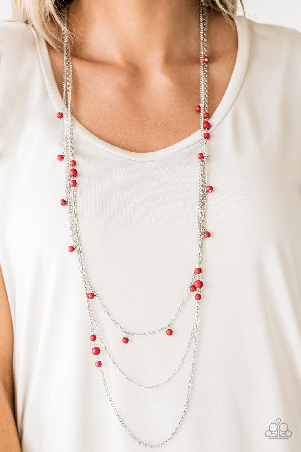 Paparazzi Accessories Laying The Groundwork - Red Infused with a plain silver chain, mismatched fiery red stone beads sporadically trickle along shimmery silver chains, creating vivacious layers down the chest. Features an adjustable clasp closure. Jewelr