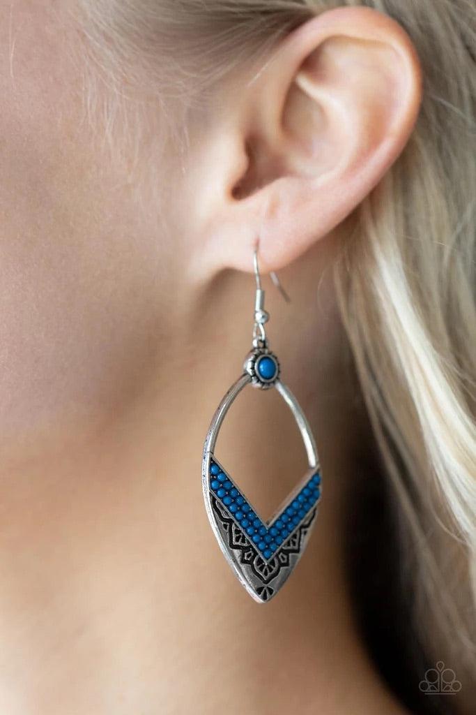 Paparazzi Accessories Indigenous Intentions - Blue Two rows of Mykonos Blue seed beads create a V at the bottom of an airy silver frame embossed and stamped in indigenous inspired patterns. A matching Mykonos Blue seed bead adorns the top of the frame, ad