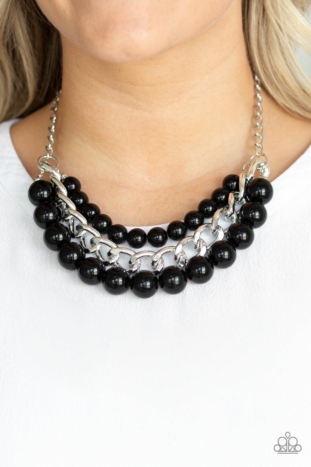 Paparazzi Accessories Empire State Empress - Black Two strands of dramatic black beads flank one strand of oversized silver chain, creating statement-making layers below the collar. Features an adjustable clasp closure. Sold as one individual necklace. In