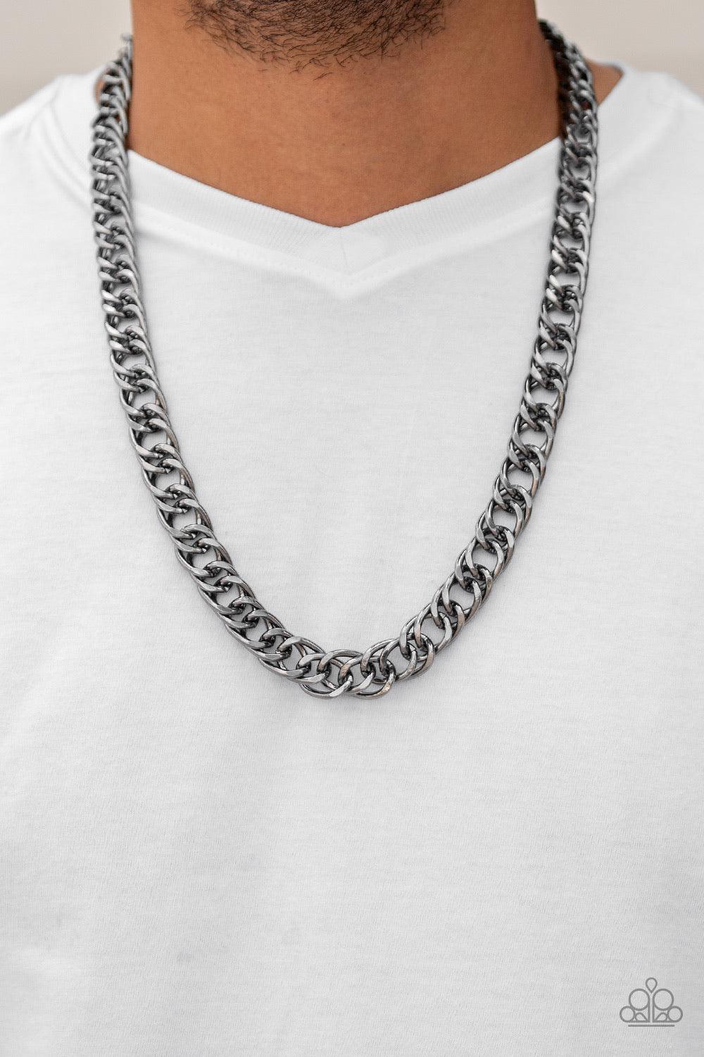Paparazzi Accessories Omega - Black Featuring double links, an oversized gunmetal beveled cable chain drapes across the chest for a sleek, upscale look. Features an adjustable clasp closure. Jewelry