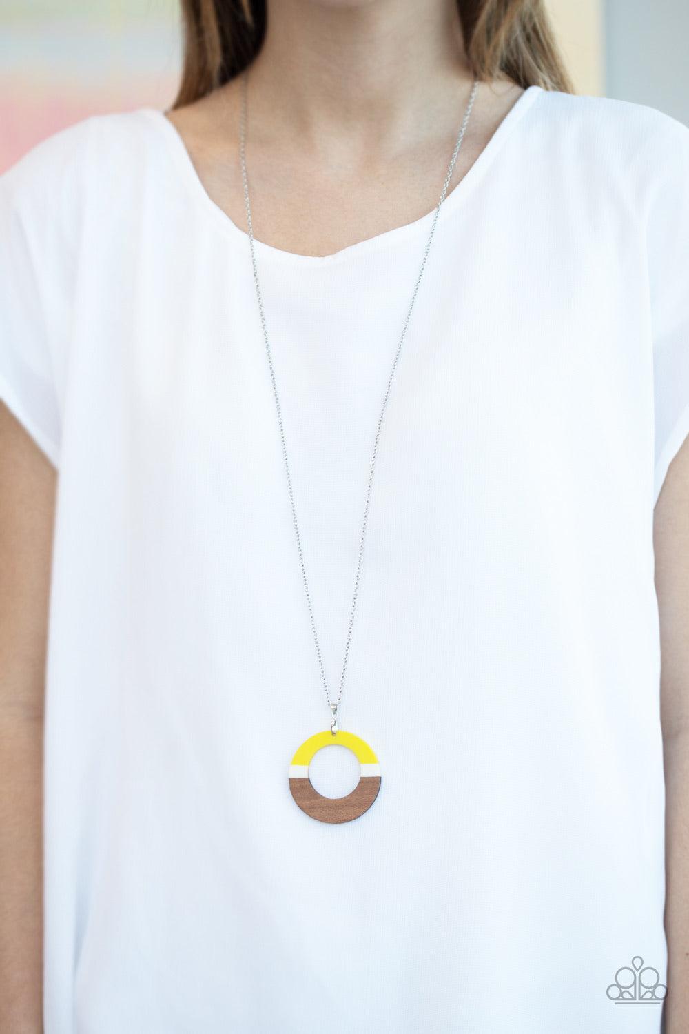 Paparazzi Accessories Sail Into the Sunset - Yellow Painted in yellow and white stripes, an earthy brown wooden hoop swings from the bottom of a lengthened silver chain for a seasonal flair. Features an adjustable clasp closure. Jewelry