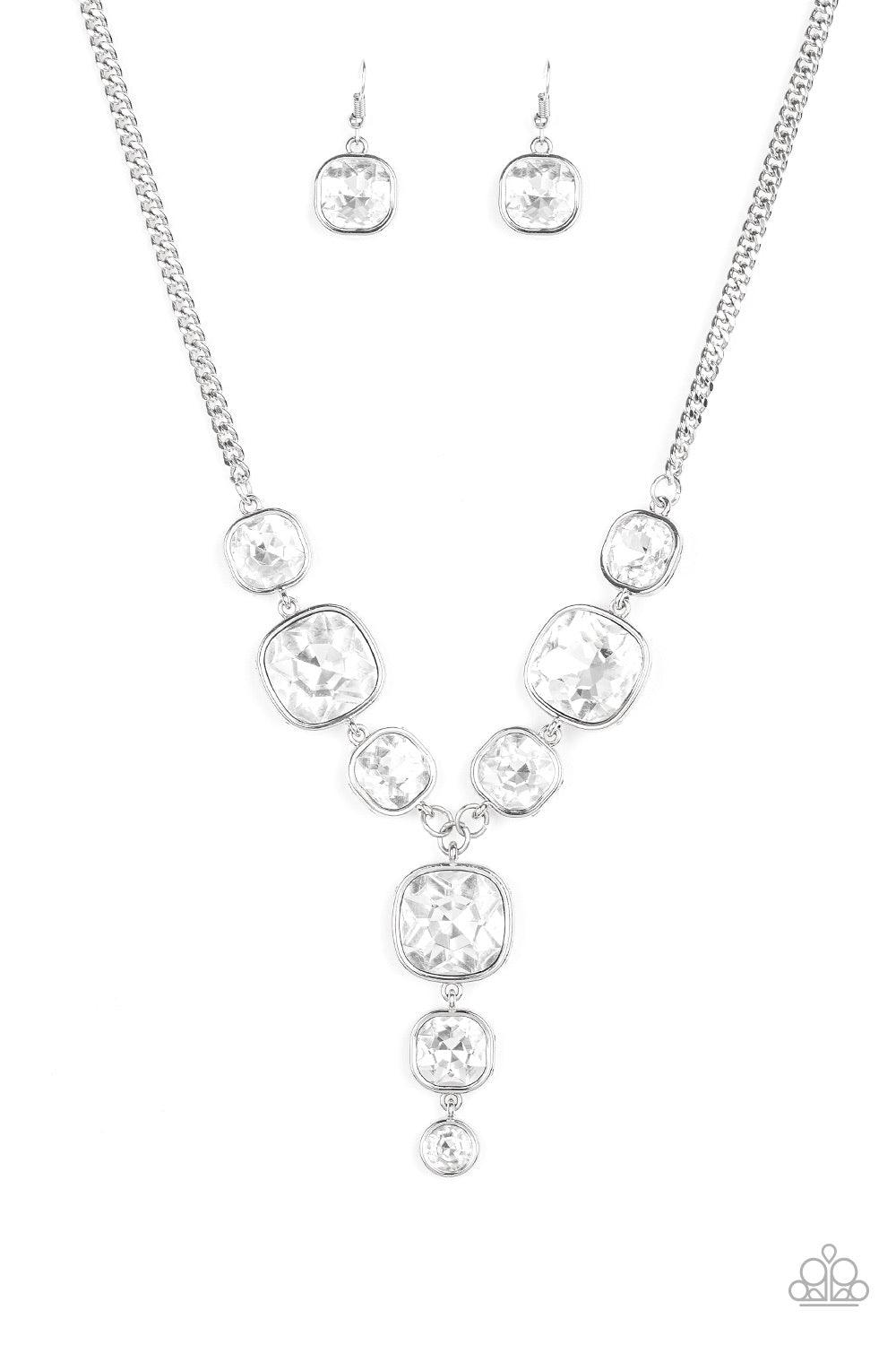 Paparazzi Accessories Legendary Luster - White Featuring sleek silver frames, a dramatic collection of white gems cascade from the bottom thick silver chain. Additional gems trickle from the center, creating a glamorous extended pendant below the collar.