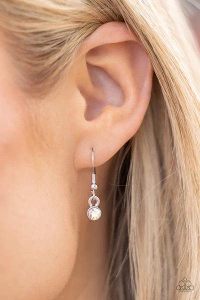 Paparazzi Accessories Extragalactic Extravagance - Multi Featuring a stellar radiance, clusters of teardrop and marquise cut iridescent rhinestones fan out from white rhinestone centers along the tops of studded and pronged triangular frames. The centermo