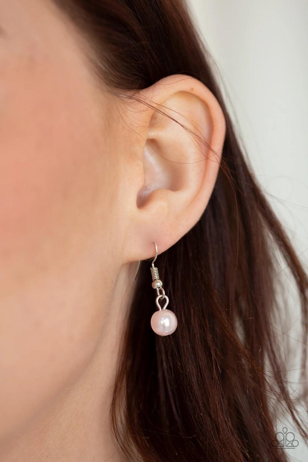 Paparazzi Accessories Unapologetic Flirt - Pink Infused with sections of shimmery silver chains, an assortment of hammered silver discs and silver rings link across the chest. A collection of pearly pink beads and dainty silver heart charms asymmetrically