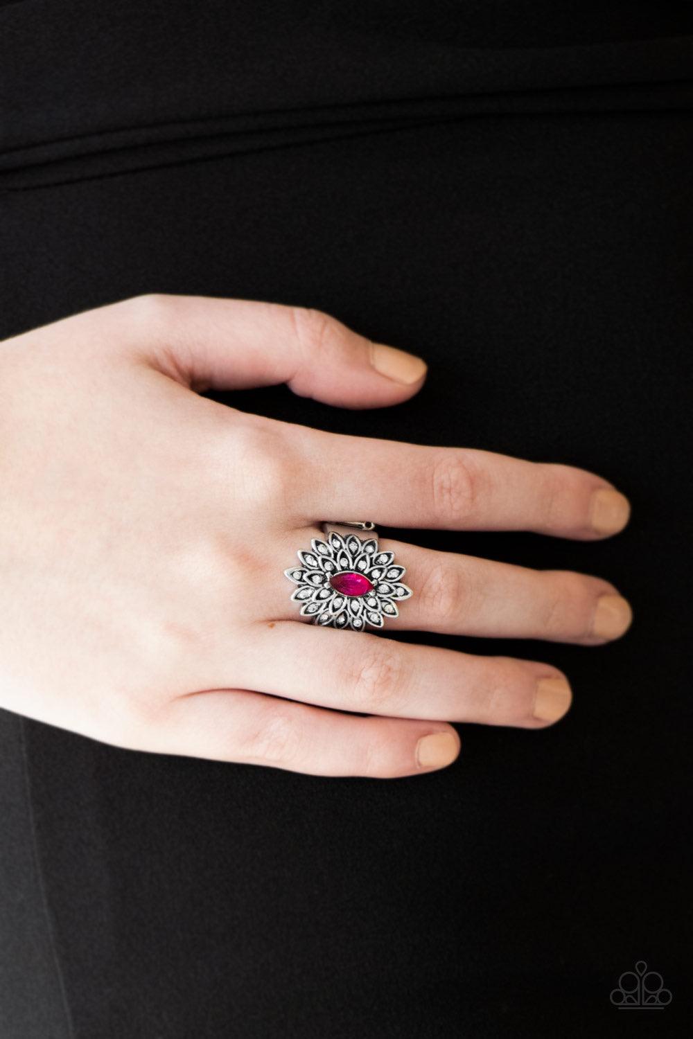 Paparazzi Accessories Blooming Fireworks - Pink Dotted in dainty white rhinestones, silver petals radiate from a regal pink marquise shaped rhinestone center for an edgy look. Features a stretchy band for a flexible fit. Jewelry