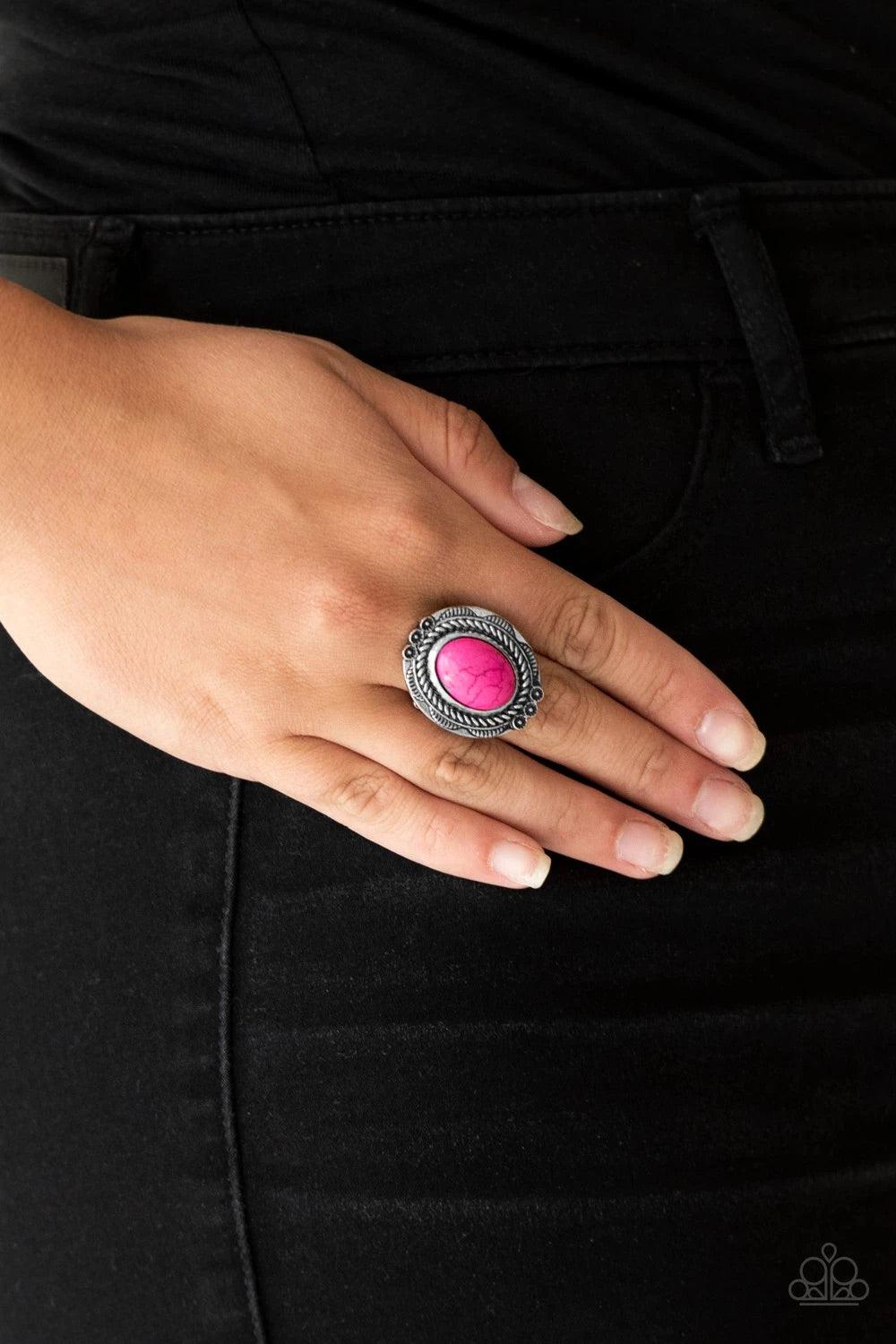 Paparazzi Accessories Tumbling’ Tumbleweed - Pink A vivacious pink stone is pressed into an antiqued silver frame radiating with floral detail for a seasonal look. Features a stretchy band for a flexible fit. Jewelry