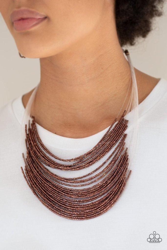 Paparazzi Accessories Catwalk Queen - Copper Strand after strand of metallic copper seed beads fall together to create a bold statement piece. Features an adjustable clasp closure. Sold as one individual necklace. Includes one pair of matching earrings. J