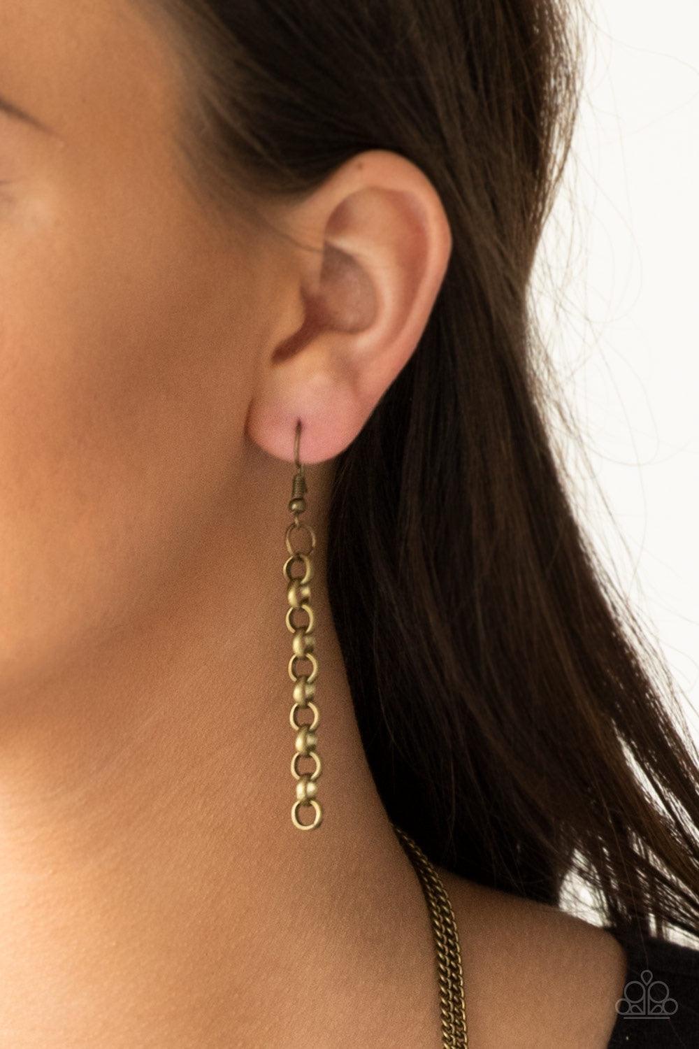 Paparazzi Accessories Mechanical Mayhem - Brass Bold brass chain links give way to layers of mismatched brass chain, creating a dramatic industrial collision. Features an adjustable clasp closure. Jewelry