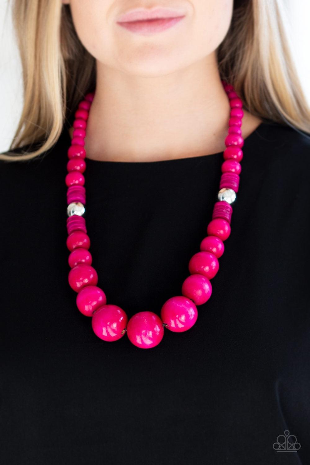 Paparazzi Accessories Panama Panorama - Pink Infused with dramatic silver beads, an array of vivacious pink wooden beads drape across the chest for a summery look. Features a button-loop closure. Jewelry