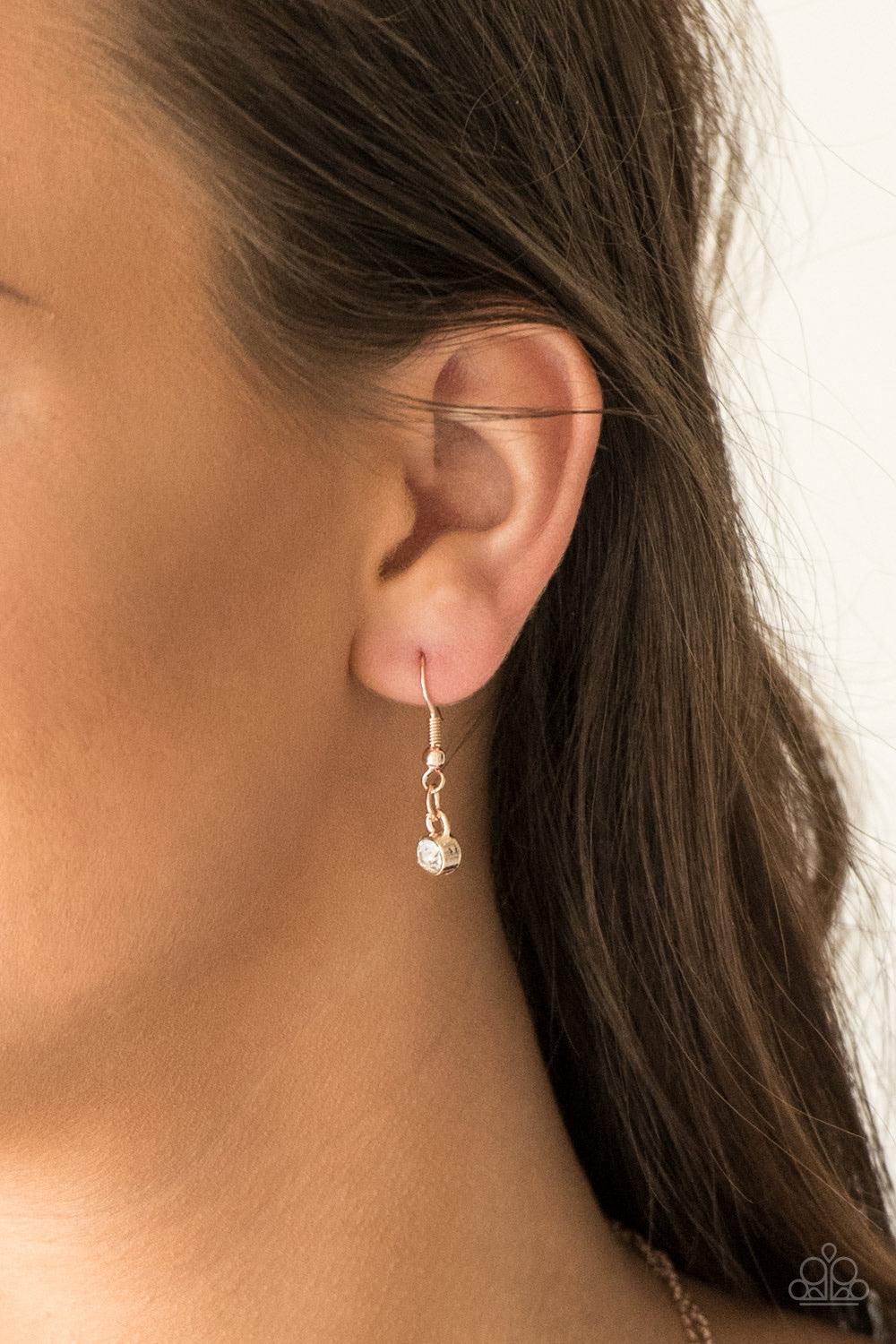 Paparazzi Accessories Pretty Petite - Rose Gold Encrusted in glassy white rhinestones, three dainty rose gold frames layer below the collar for a classic look. Features an adjustable clasp closure. Sold as one individual necklace. Includes one pair of mat