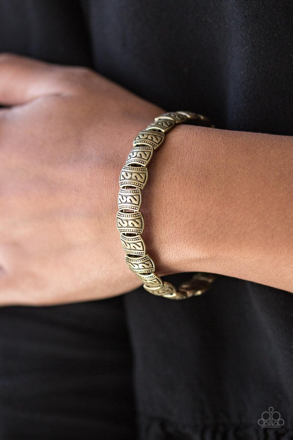 Paparazzi Accessories Montezuma Mountains - Brass Embossed in tribal inspired patterns, dainty brass frames are threaded along a brass wire and wrapped around the wrist for a seasonal look. Features an adjustable clasp closure. Sold as one individual brac