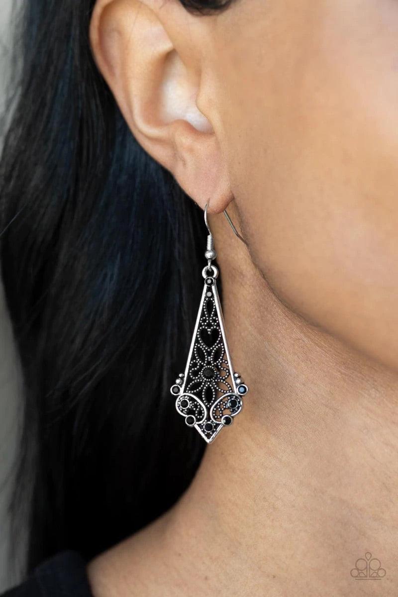 Paparazzi Accessories Casablanca Charisma - Black Dotted heart and flower filigree motifs permeate an elongated diamond-shaped silver frame. Dainty black rhinestones scatter across the design creating a whimsical lure. Earring attaches to a standard fishh