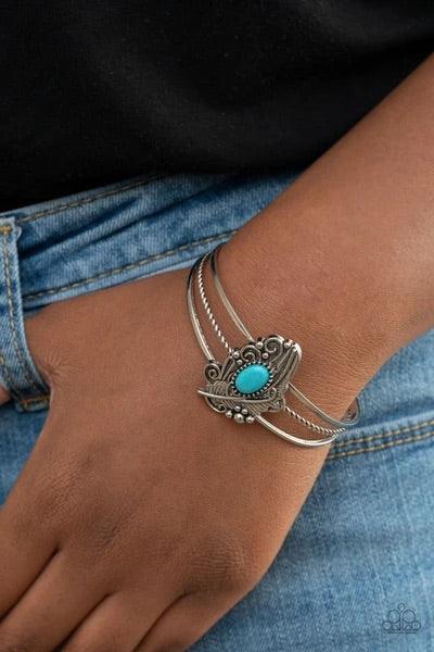 Paparazzi Accessories Sahara Solstice - Blue Dotted with a refreshing turquoise stone accent, a decorative silver feather frame is pressed into the center of an ornately layered cuff for a whimsical vibe. Sold as one individual bracelet. Jewelry