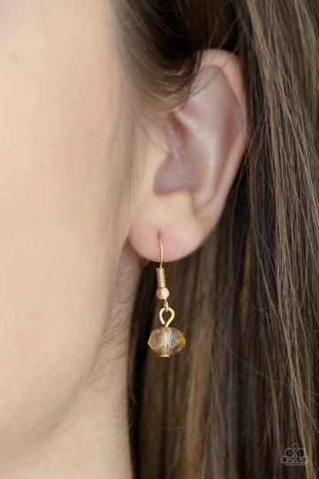Paparazzi Accessories Turn Up The Tea Lights - Brown A fiery collection of red teardrop stones fan out from a textured silver ring, creating a scalloped floral frame at the bottom of a round red stone dotted frame. Earring attaches to a standard fishhook